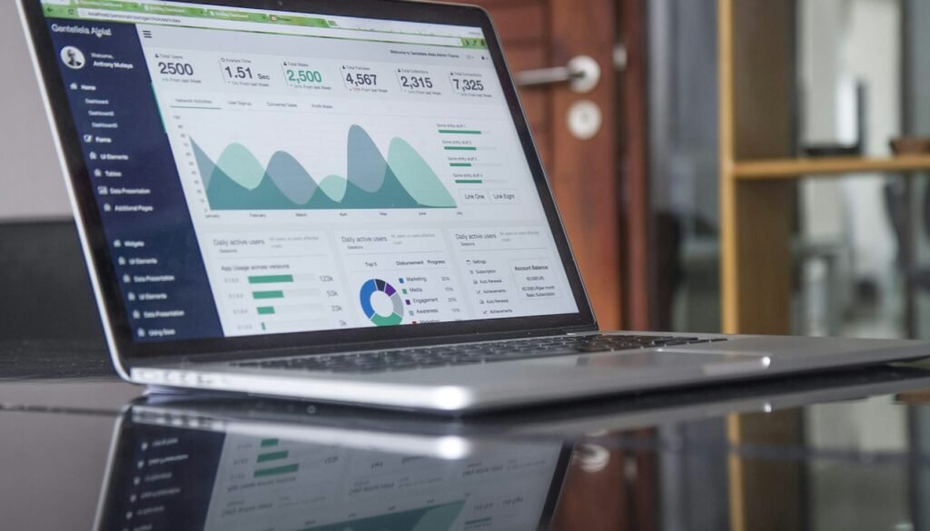 Marketer reviewing AI search visibility metrics on a laptop dashboard