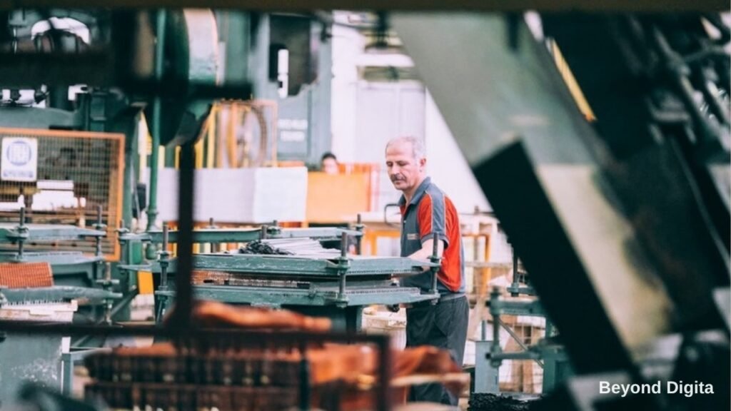 B2B lead generation for manufacturers, worker operating machinery on a factory floor, Beyond Digita