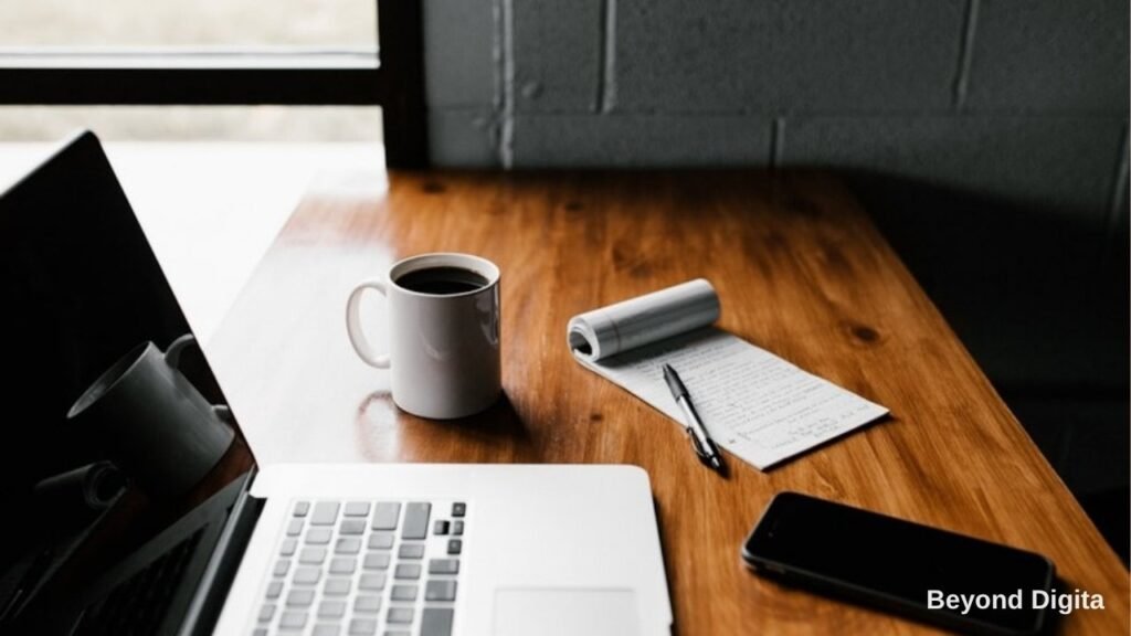 Content marketing for B2B lead generation, laptop and notebook on a desk, Beyond Digita