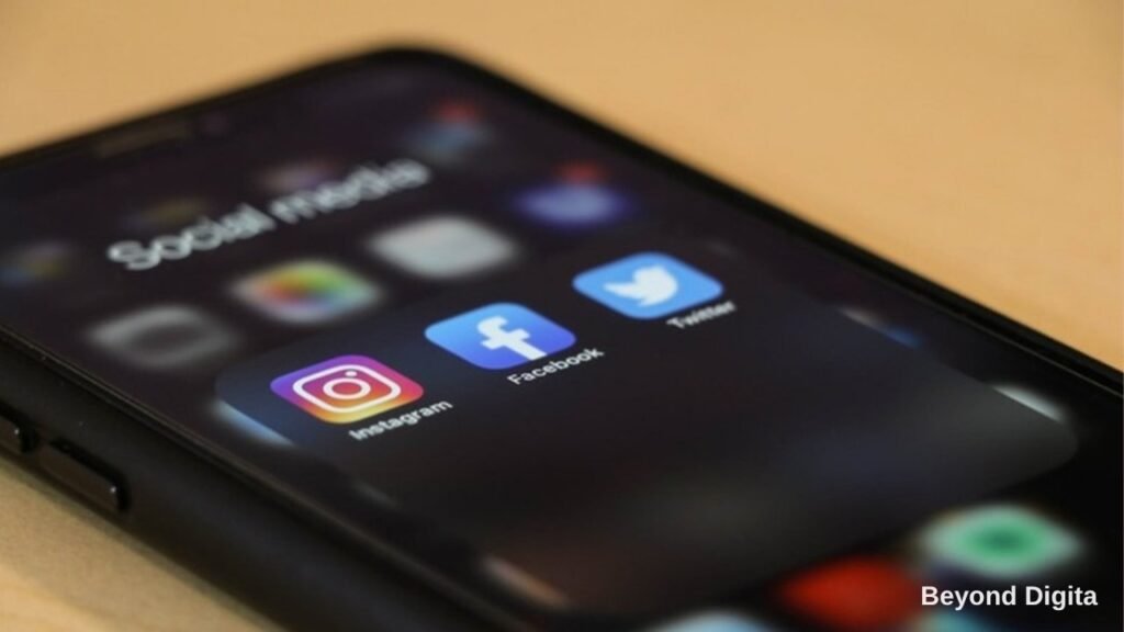 Meta Ads vs Google Ads, smartphone showing Instagram and Facebook app icons, Beyond Digita