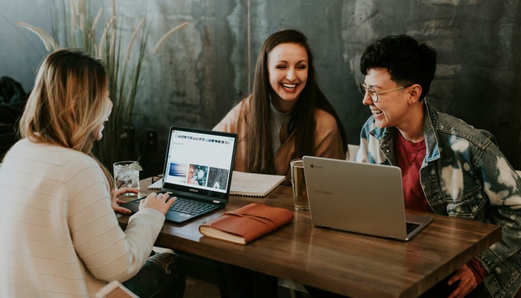 Business owner responding to customer reviews on a laptop