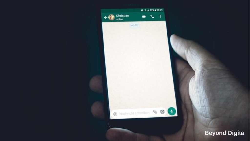 WhatsApp marketing for Indian businesses, hand holding a phone with a WhatsApp chat open, Beyond Digita